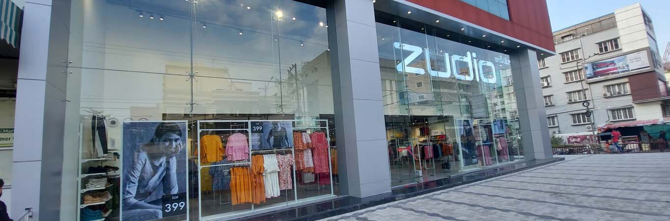 Retail clothing store interior with display racks