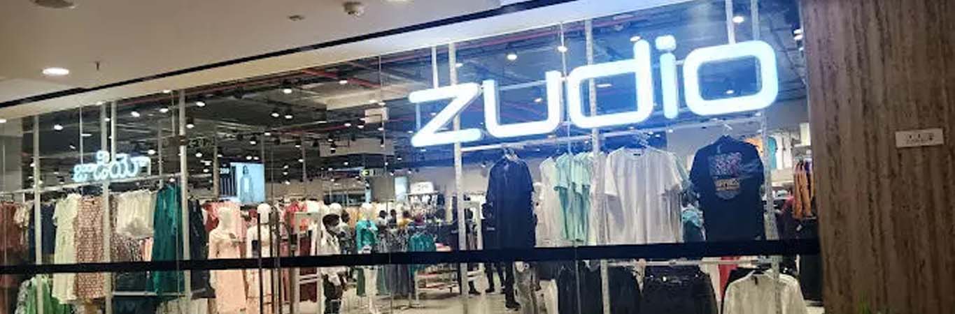 Wide clothing store aisle with apparel racks