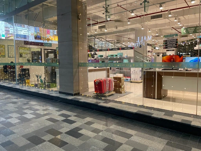 Shopping mall retail storefront with a glass facade