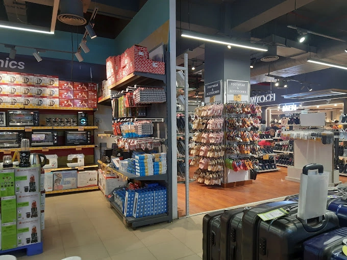 Retail interior with footwear and household product displays