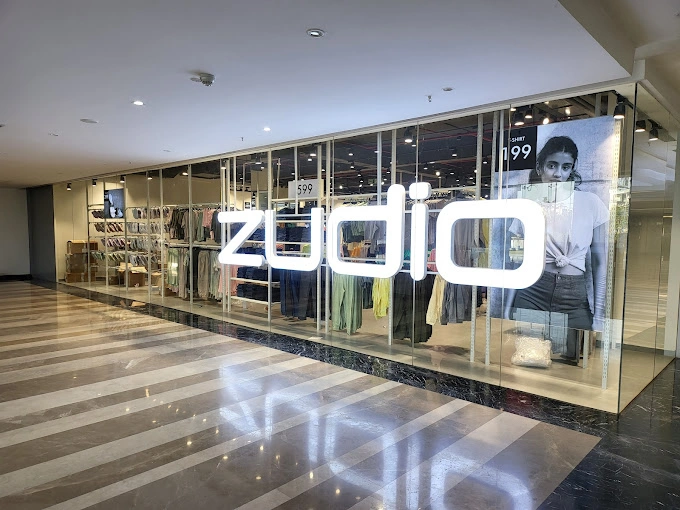 Clothing store floor with racks and wall displays